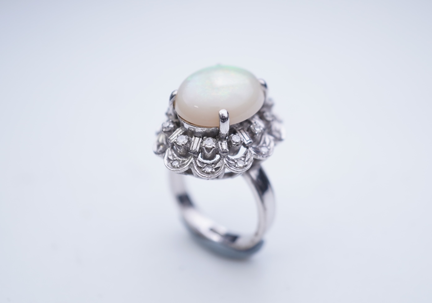 An opal and diamond cluster ring